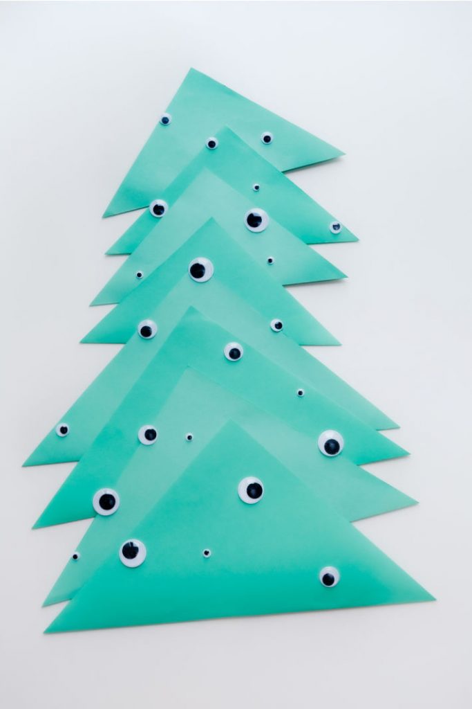 Funny Christmas tree made from paper and decorated with googly eyes