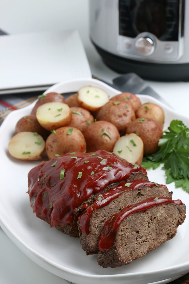 Cooked meatloaf with potatoes and ketchup- Instant Pot Meatloaf