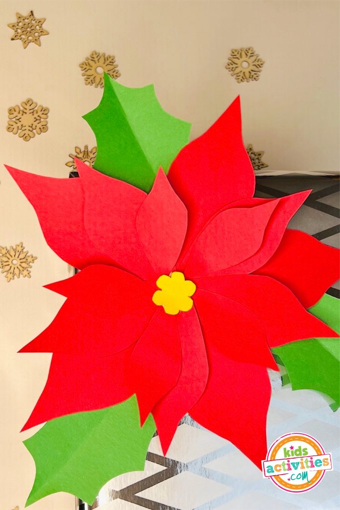 Poinsettia craft- Image shows a christmas poinsettia finished craft. from Kids Activities Blog