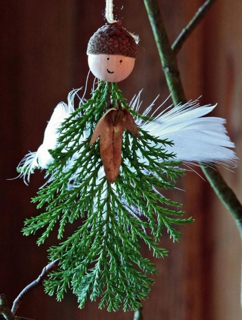 natural Christmas ornaments- Image shows a christmas angel ornament with natural materials.