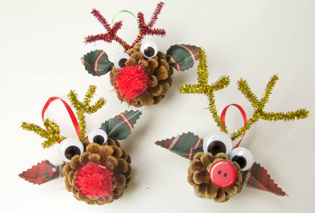 natural Christmas ornaments- Three pinecone reindeer ornaments with buttons, googly eyes and pompoms.