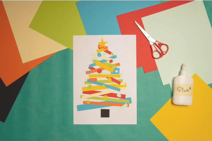 Paper Christmas tree craft made out of strips of colored paper - Kids Activities Blog