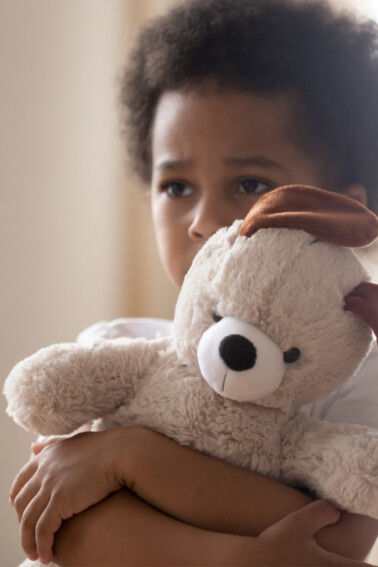 Sometimes kids just need a parent - Kids Activities Blog - boy clinging to teddy bear