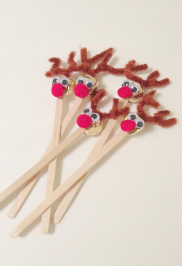 Reindeer Drink stirrers made from bells, red pom poms, and popsicle sticks.