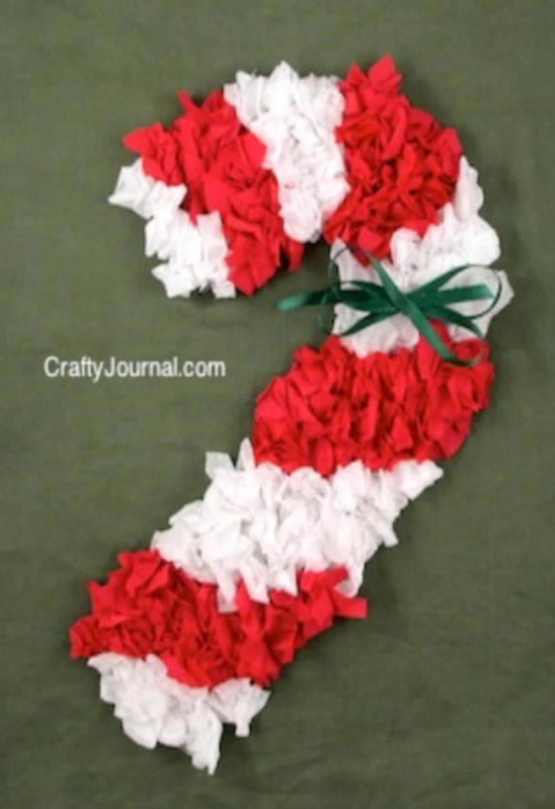 scrunched white and red paper candy cane with a green bow