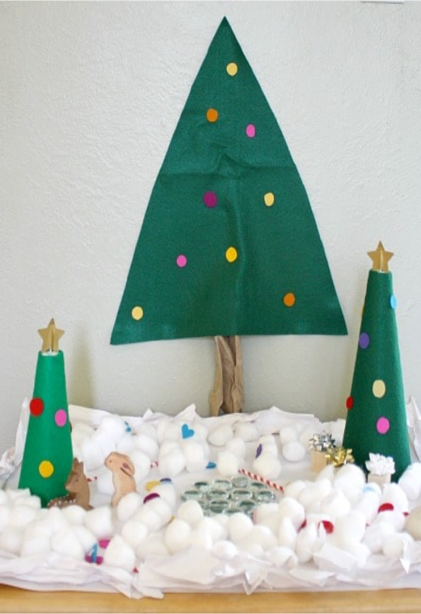 Snowy Christmas tree with fake water, snow, and presents